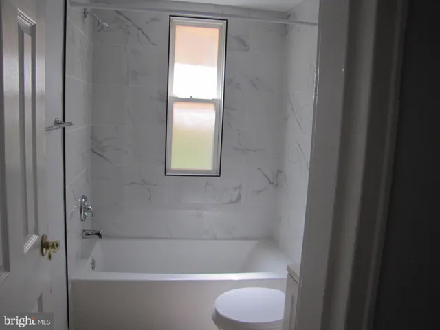a bathroom with a shower and a bathtub