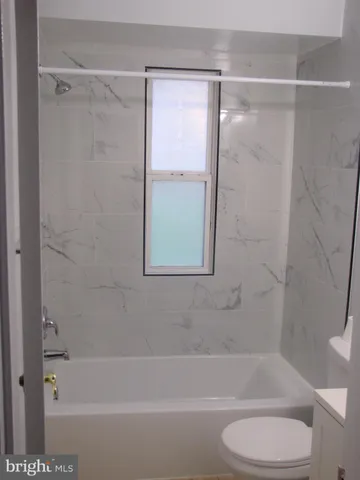 a bathroom with a shower and a bathtub
