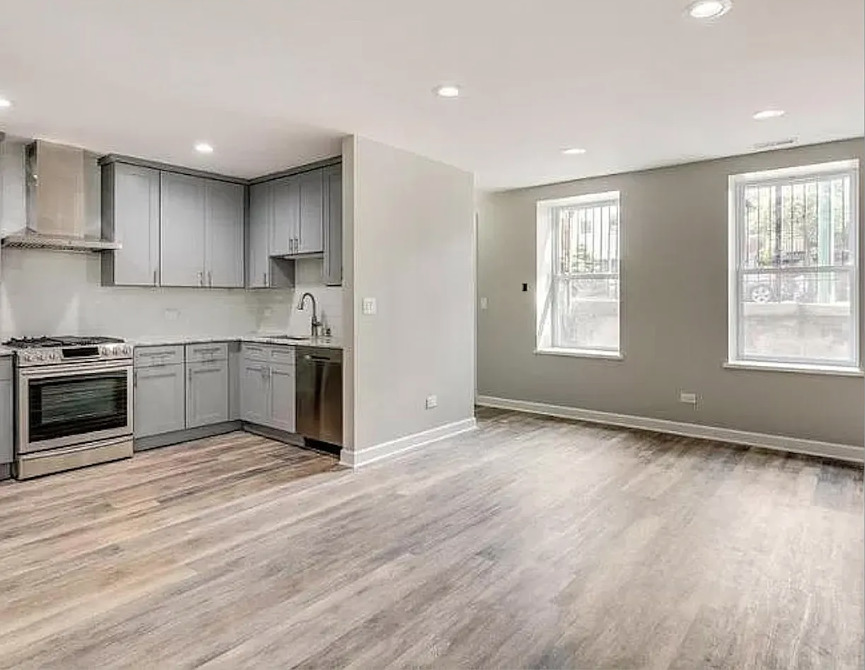 1930 South Morgan Street, Unit 1 Chicago, IL 60608 - Photo 11 of 11 a kitchen with stainless steel appliances granite countertop a stove a sink and a refrigerator