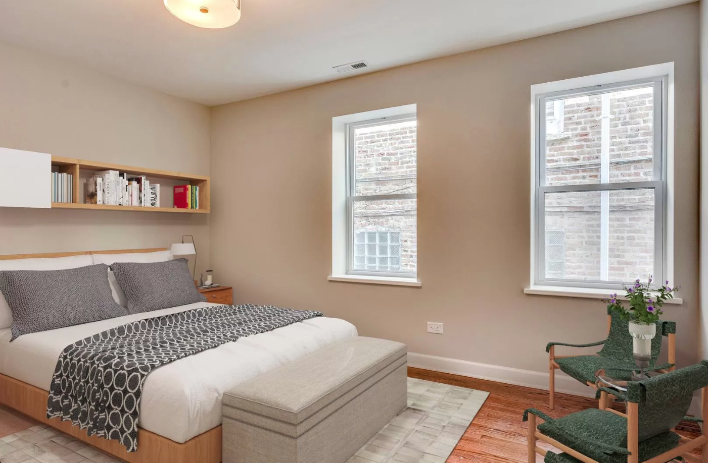 1930 South Morgan Street, Unit 1 Chicago, IL 60608 - Photo 7 of 11 a bedroom with a bed and wooden floor