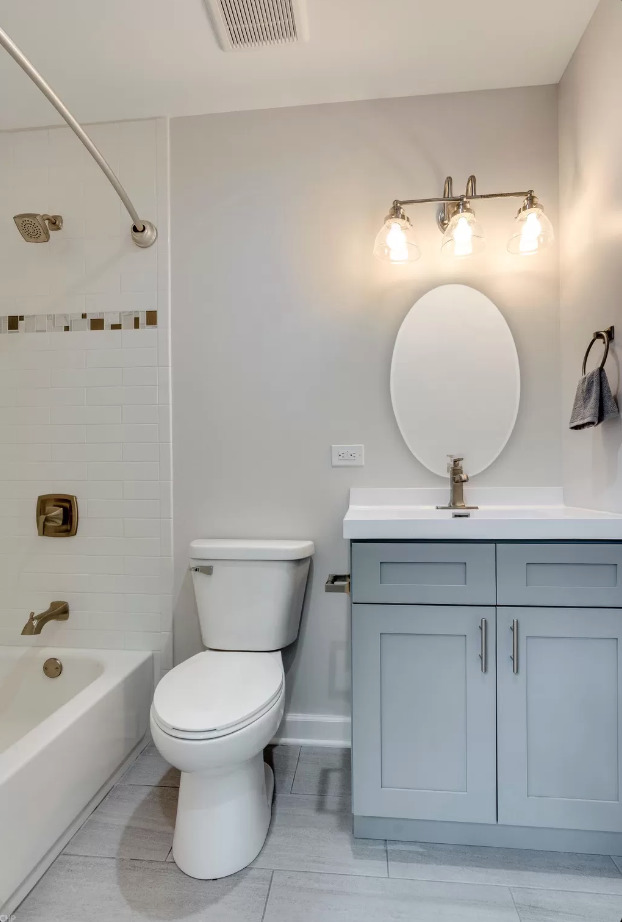 1930 South Morgan Street, Unit 1 Chicago, IL 60608 - Photo 8 of 11 a bathroom with a toilet sink and mirror