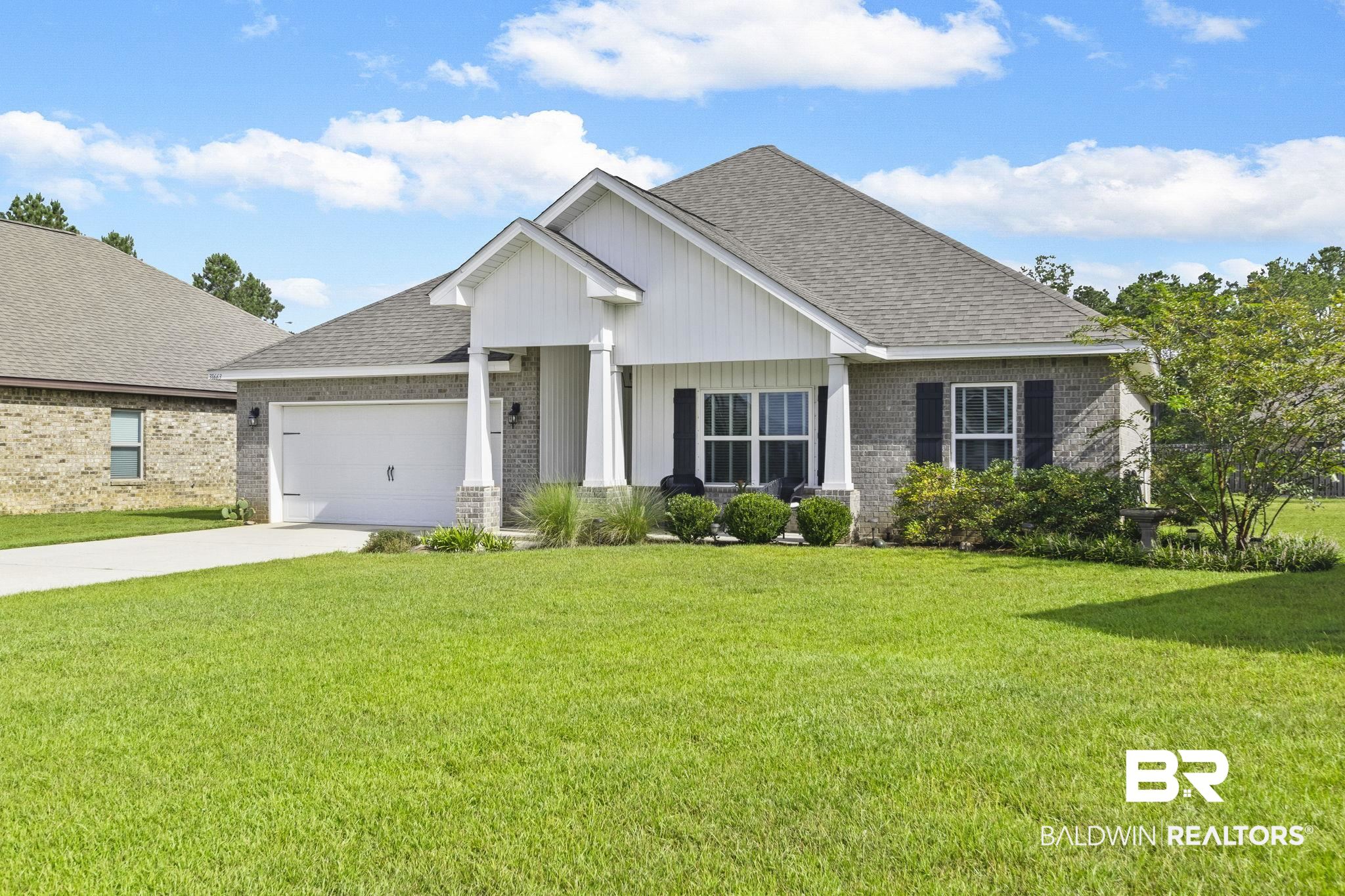 31663 Kestrel Loop Daphne, AL 36527 - Photo 7 of 86 View of front facade with a front lawn and a garage