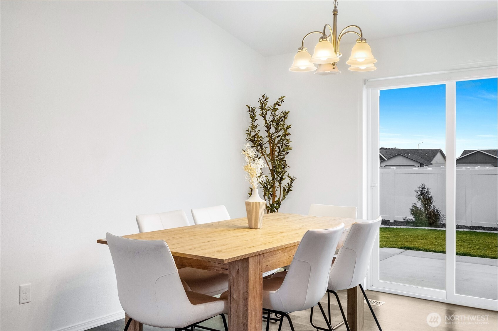 1313 Polo Ridge Moses Lake, WA 98837 - Photo 11 of 37 a view of a dining room with furniture and chandelier