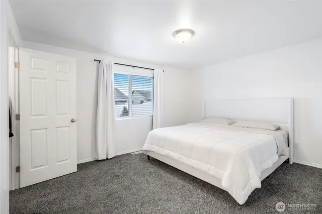 a bedroom with a bed and closet