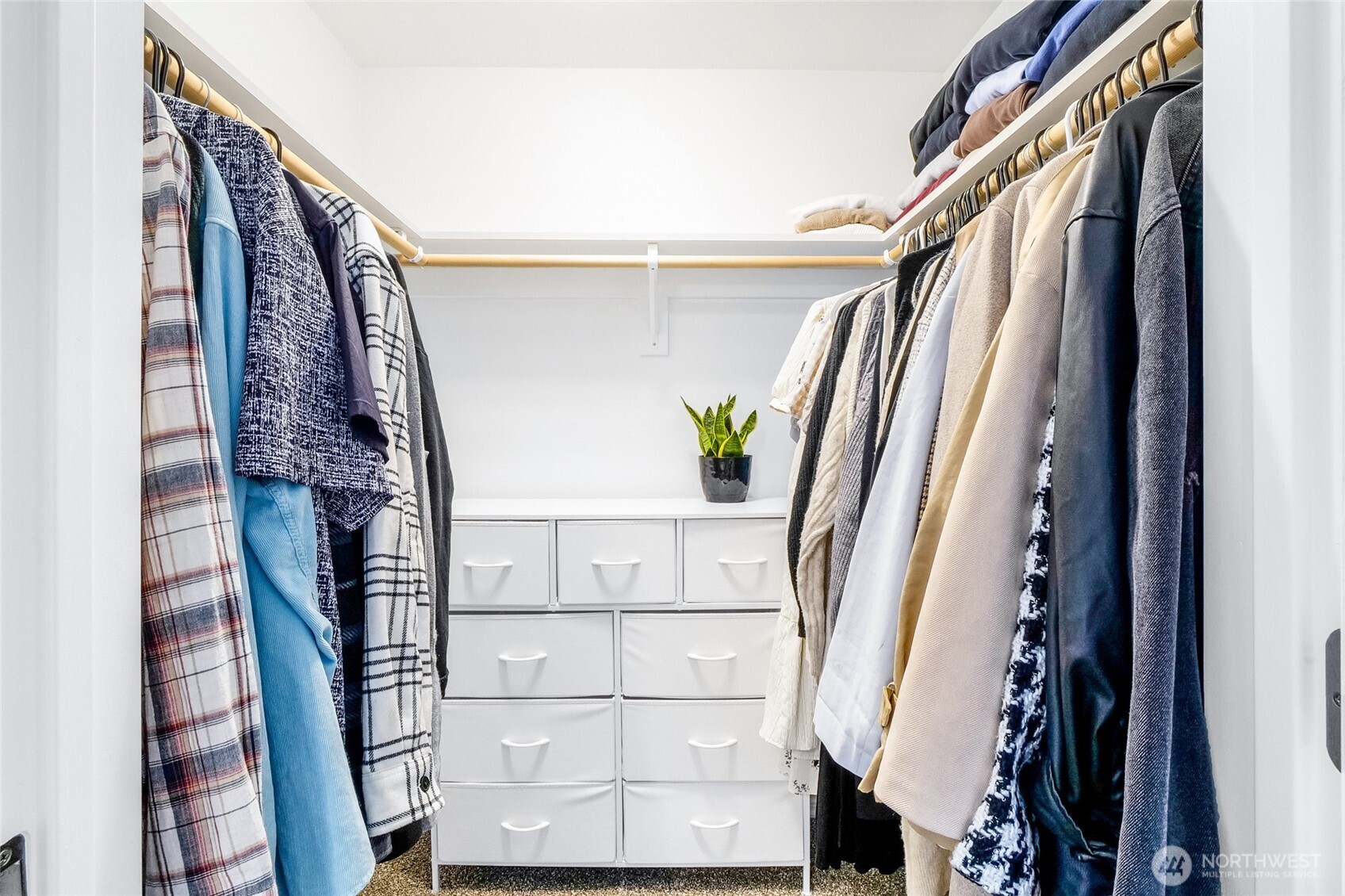 1313 Polo Ridge Moses Lake, WA 98837 - Photo 22 of 37 a view of walk in closet with wooden floor and stairs