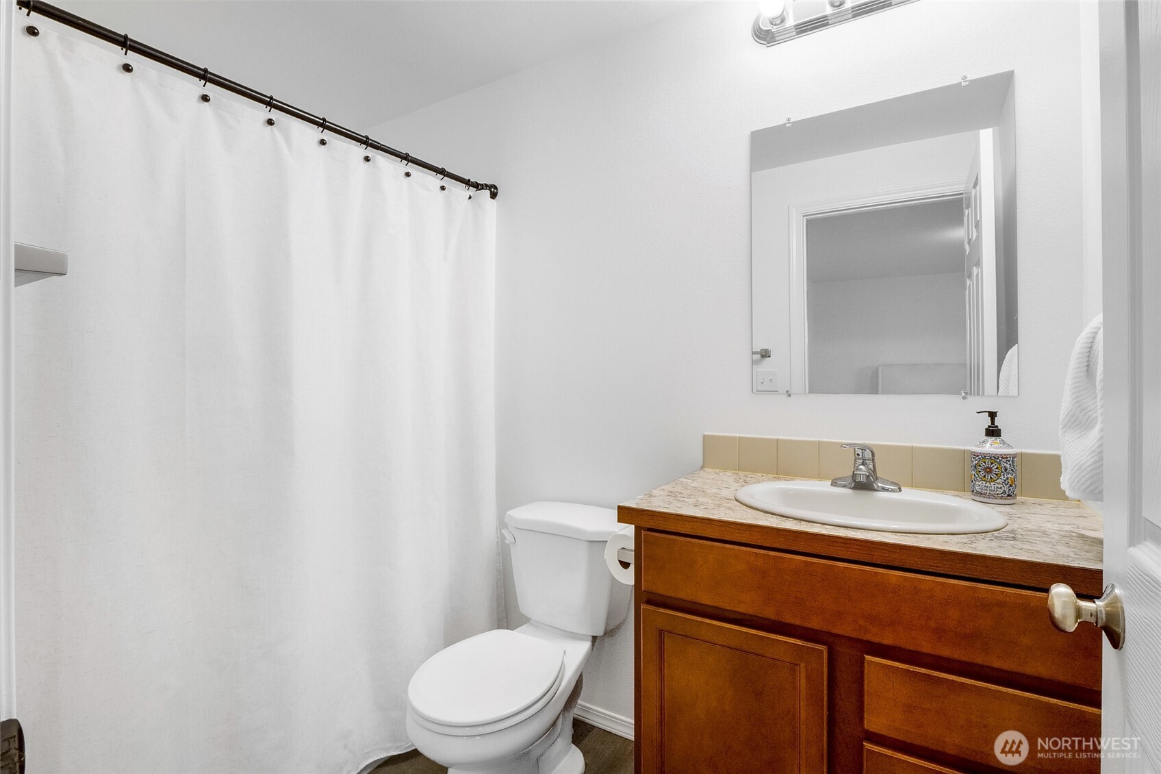 1313 Polo Ridge Moses Lake, WA 98837 - Photo 23 of 37 a bathroom with a granite countertop sink toilet and mirror