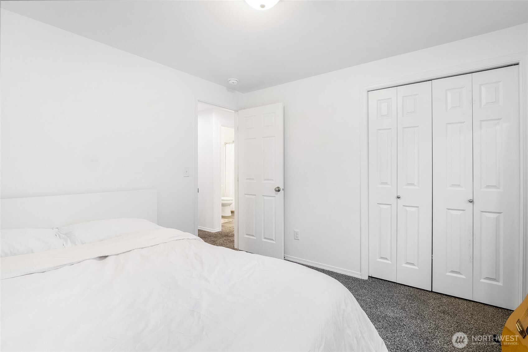 1313 Polo Ridge Moses Lake, WA 98837 - Photo 27 of 37 a large white bed in a white room