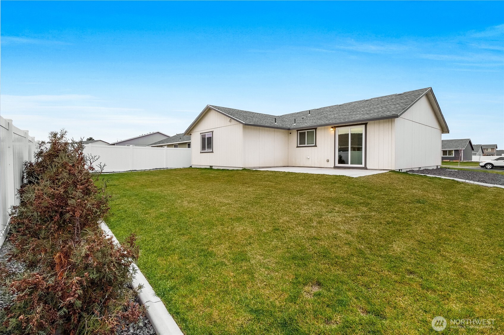 1313 Polo Ridge Moses Lake, WA 98837 - Photo 32 of 37 a view of a house with a yard
