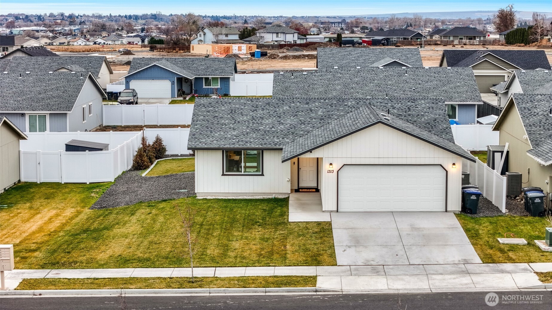 1313 Polo Ridge Moses Lake, WA 98837 - Photo 37 of 37 an aerial view of a house with a yard
