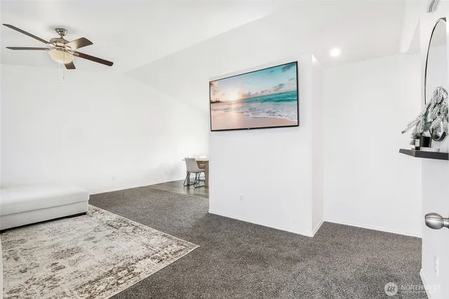 a view of a bedroom with a bed