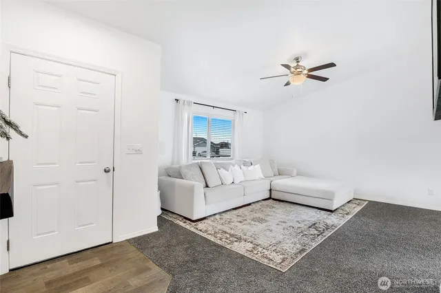 a living room with furniture and a rug