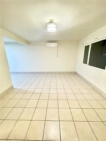 a bathroom with a sink a toilet a mirror and shower