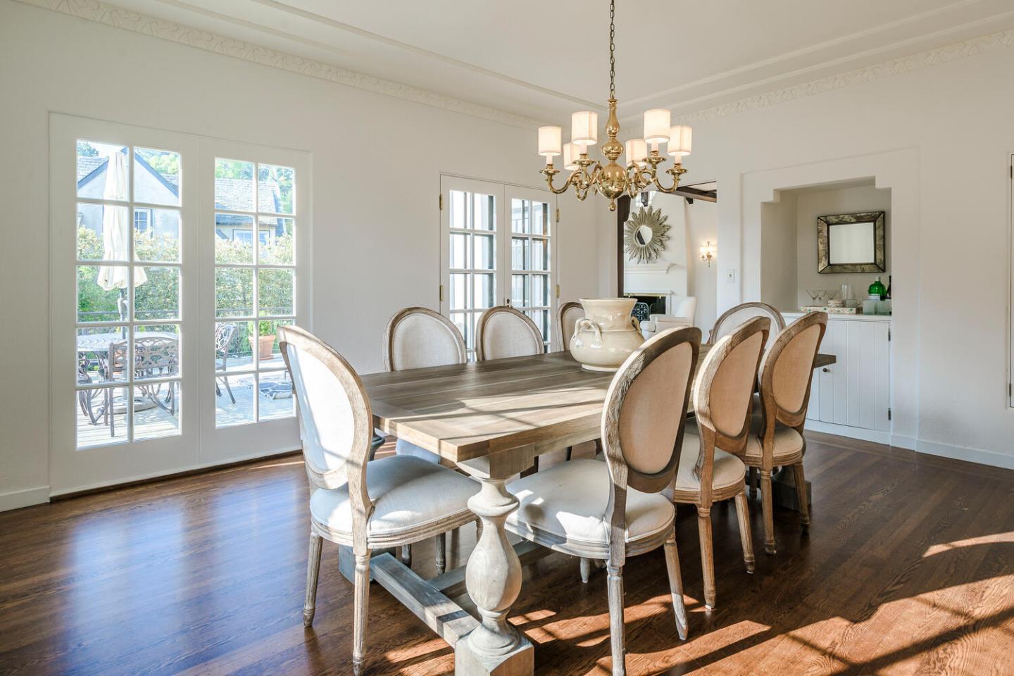 595 Hayne Road Hillsborough, CA 94010 - Photo 11 of 71 a dining room with furniture a chandelier and wooden floor