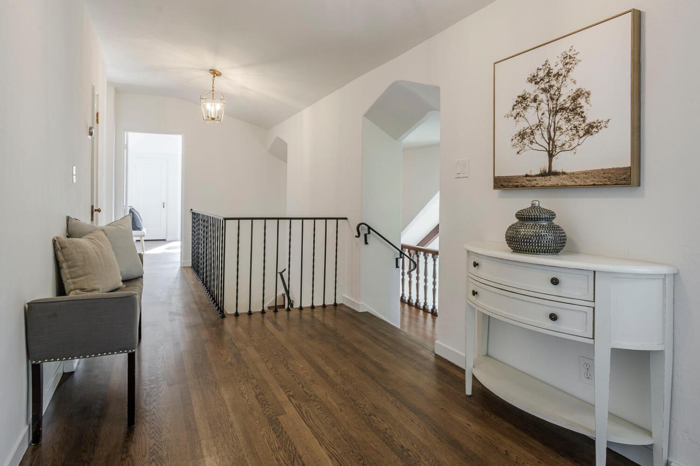 595 Hayne Road Hillsborough, CA 94010 - Photo 21 of 71 a hallway with furniture and wooden floor