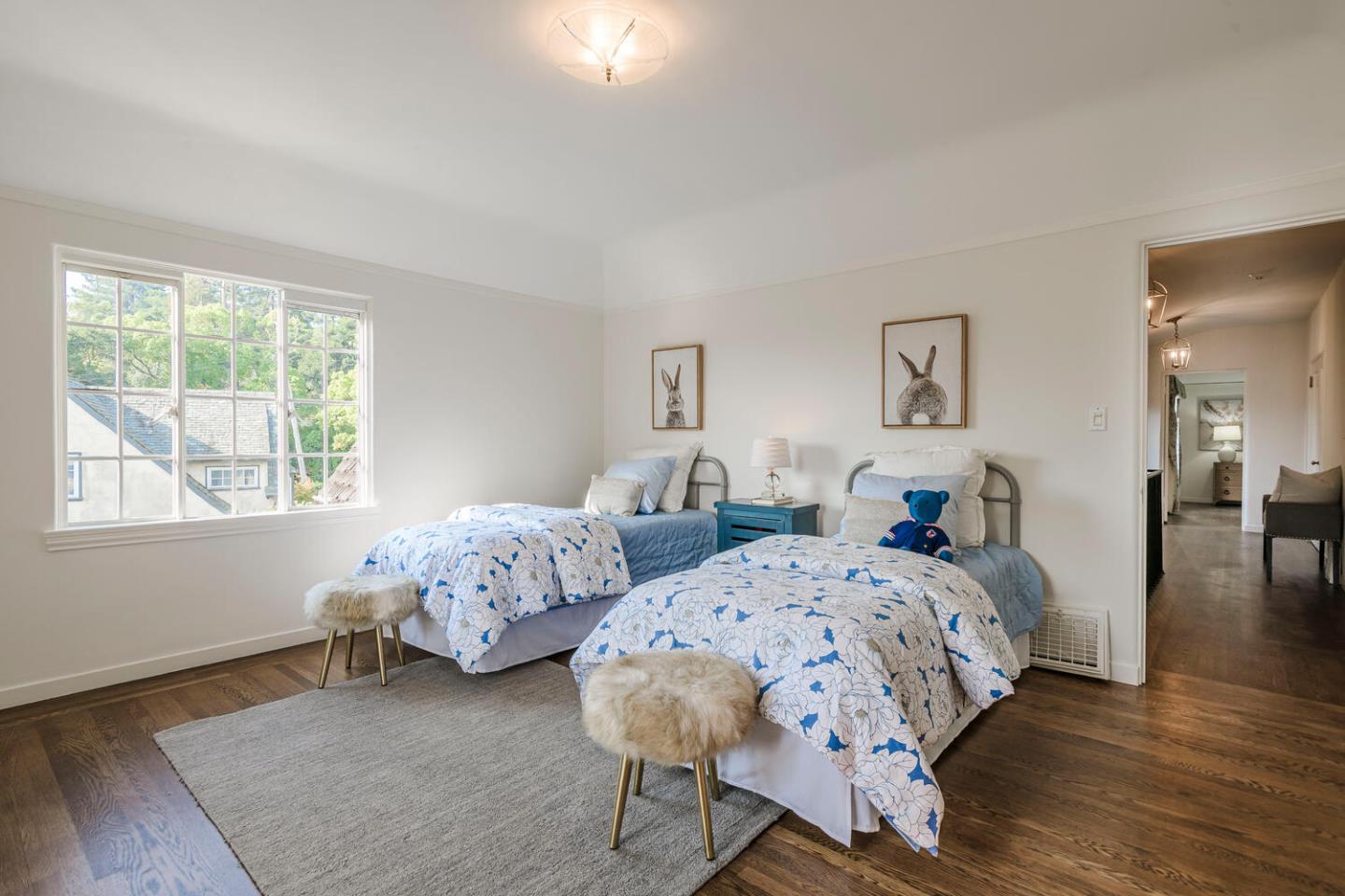 595 Hayne Road Hillsborough, CA 94010 - Photo 33 of 71 a bedroom with two beds and wooden floor