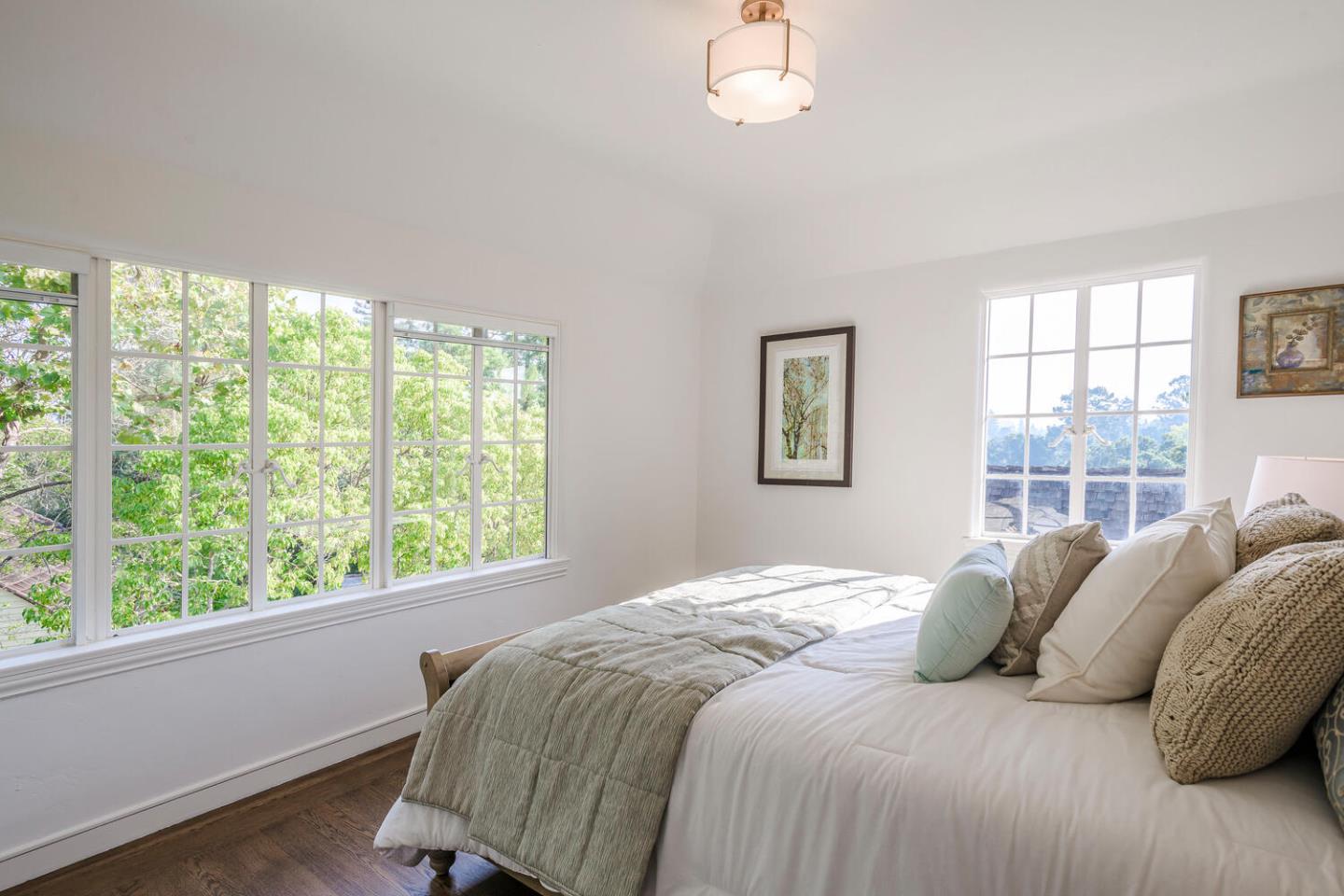 595 Hayne Road Hillsborough, CA 94010 - Photo 34 of 71 a bedroom with a large bed and a window
