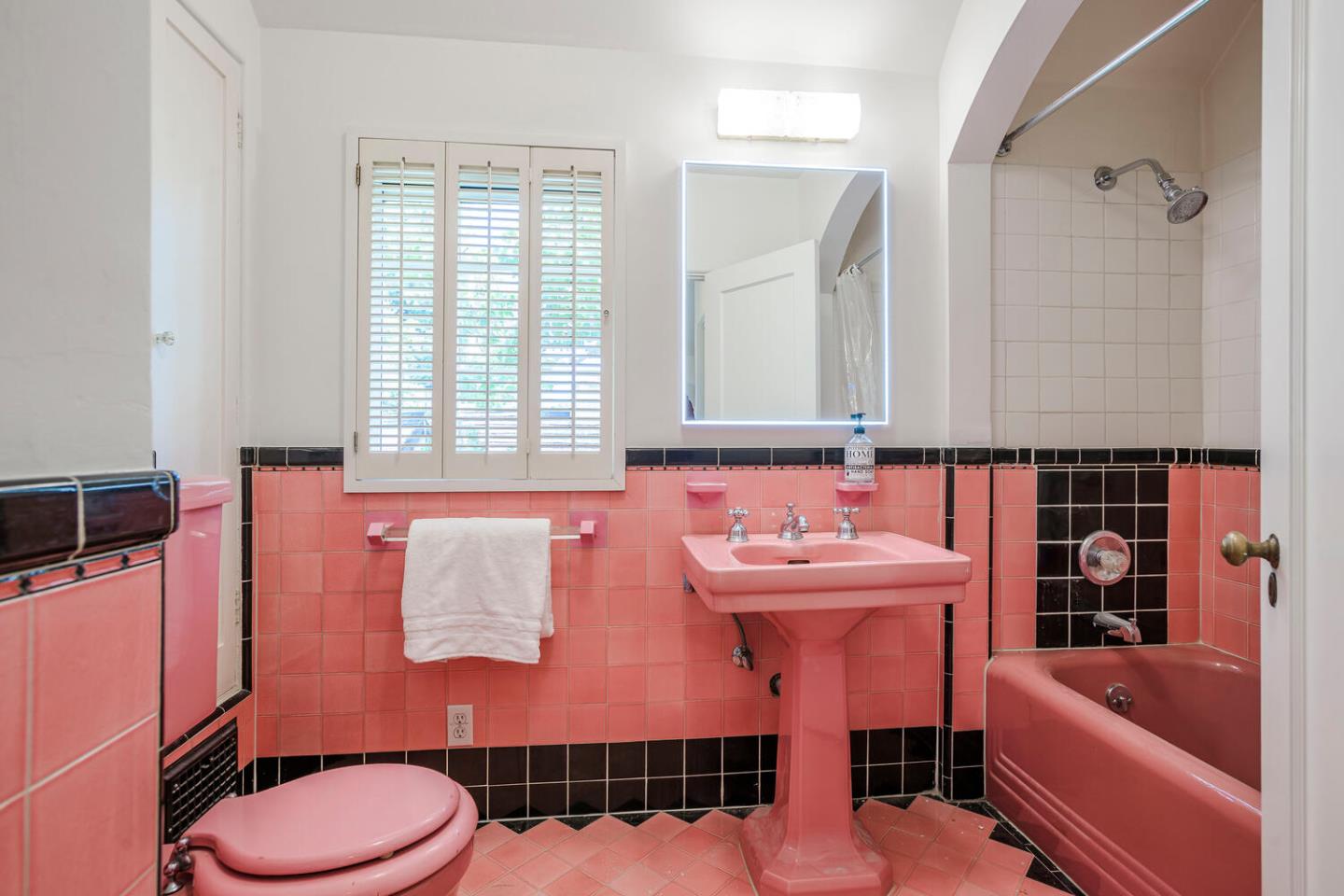 595 Hayne Road Hillsborough, CA 94010 - Photo 36 of 71 a bathroom with a sink a toilet and tub