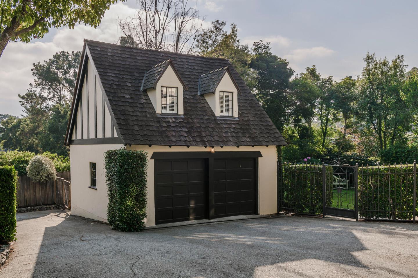 595 Hayne Road Hillsborough, CA 94010 - Photo 46 of 71 a front view of a house with a garden