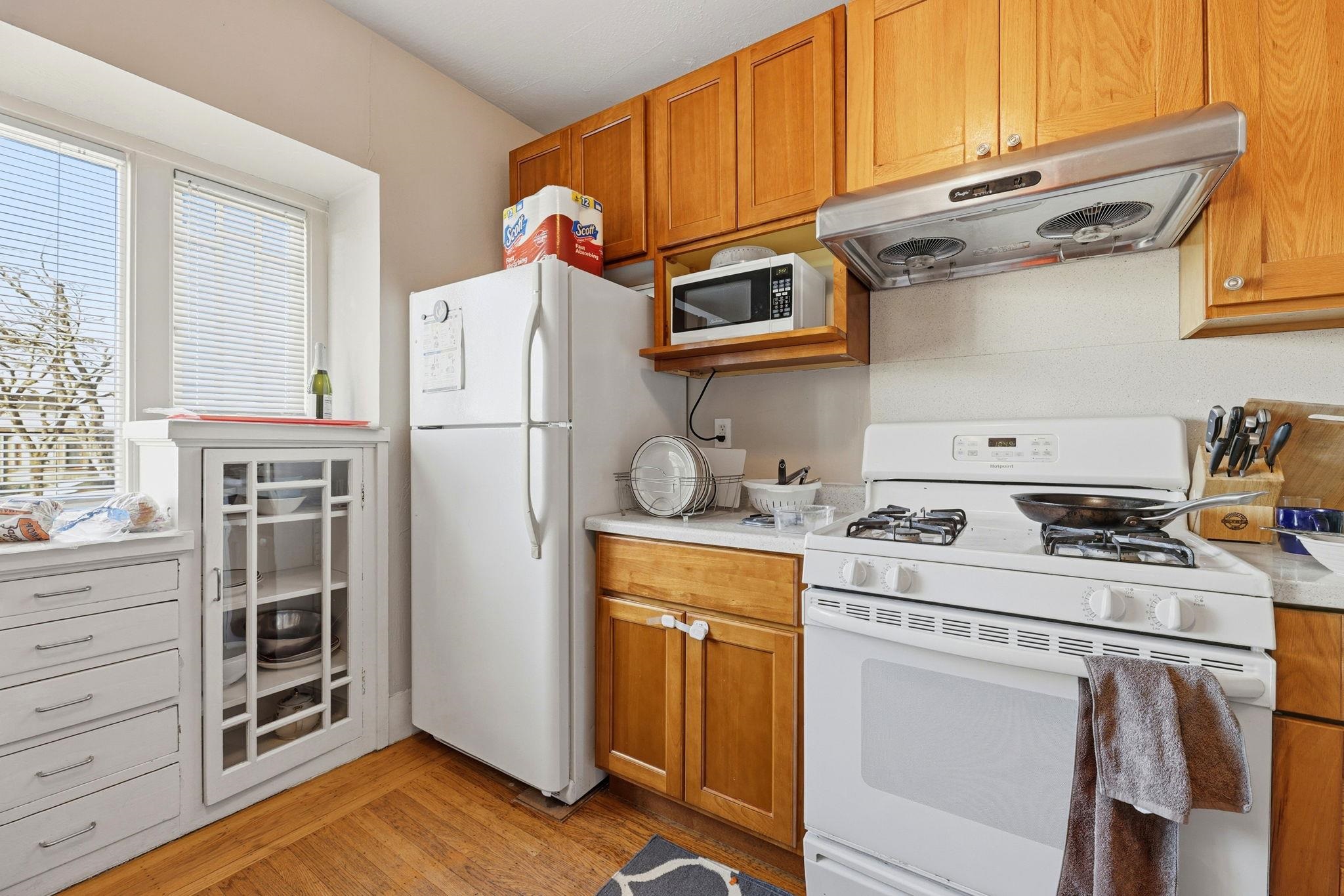 1813 Sacramento Street Berkeley, CA 94703 - Photo 29 of 31 a kitchen with stainless steel appliances granite countertop a refrigerator and a stove