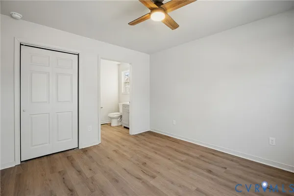 a view of an empty room and wooden floor