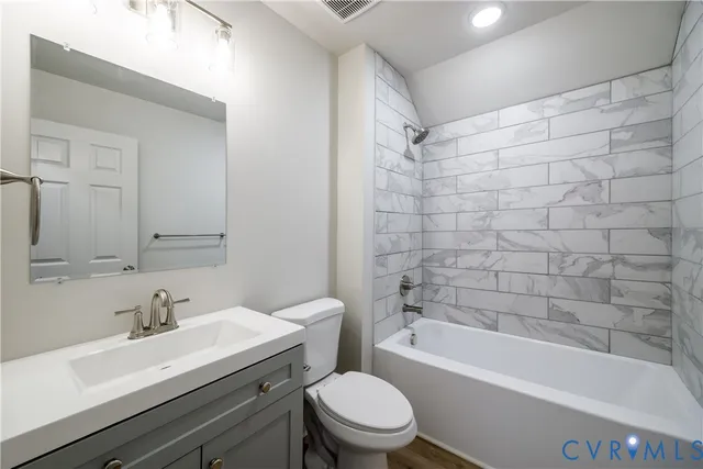 a bathroom with a sink a toilet and a bathtub