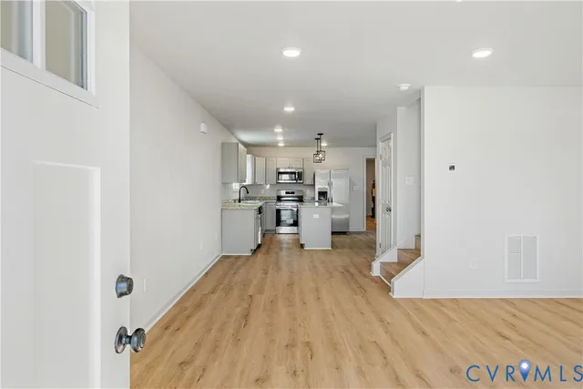 a view of kitchen with wooden floor