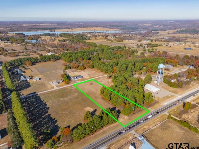 an aerial view of a house with a swimming pool