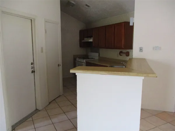 a view of a storage and utility room with a sink