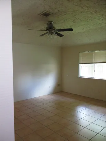 a view of an empty room with windows