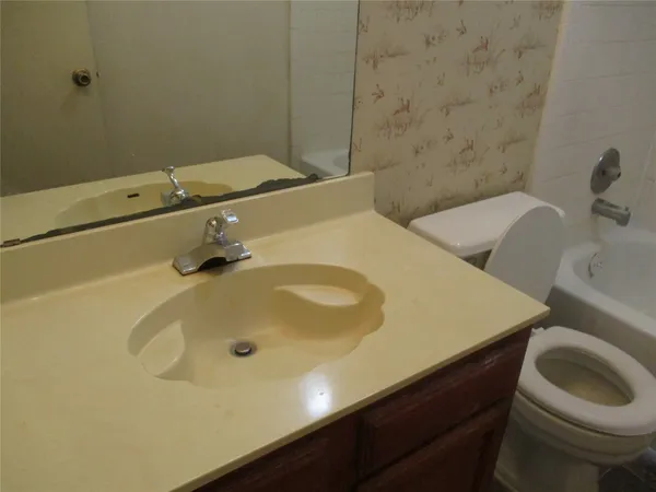 a bathroom with a sink and a toilet