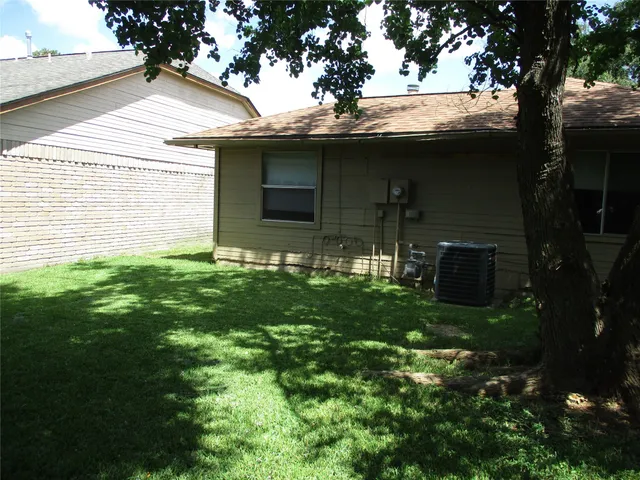 a backyard of a house with lots of green space