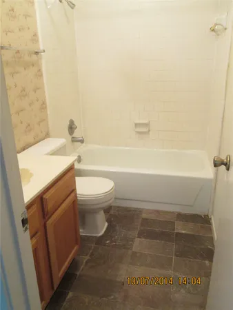 a bathroom with a sink a toilet and a bathtub