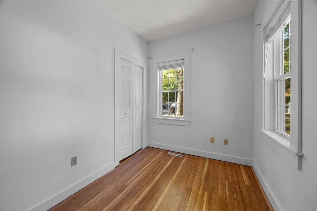 3040 Falmouth Road, Unit H Barnstable, MA 02655 - Photo 15 of 26 a view of a room with wooden floor and natural light