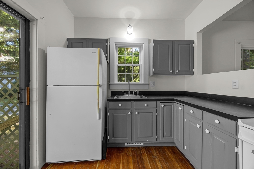 3040 Falmouth Road, Unit H Barnstable, MA 02655 - Photo 17 of 26 a kitchen with a refrigerator and a sink