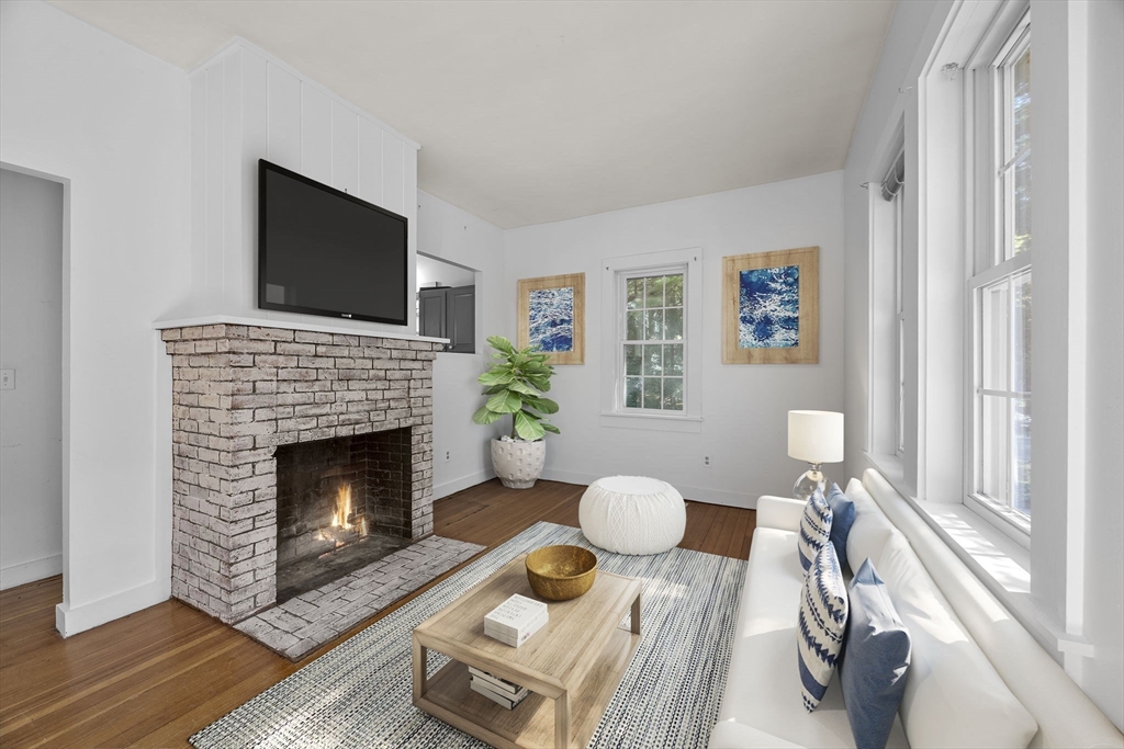 3040 Falmouth Road, Unit H Barnstable, MA 02655 - Photo 6 of 26 a living room with furniture and a fireplace