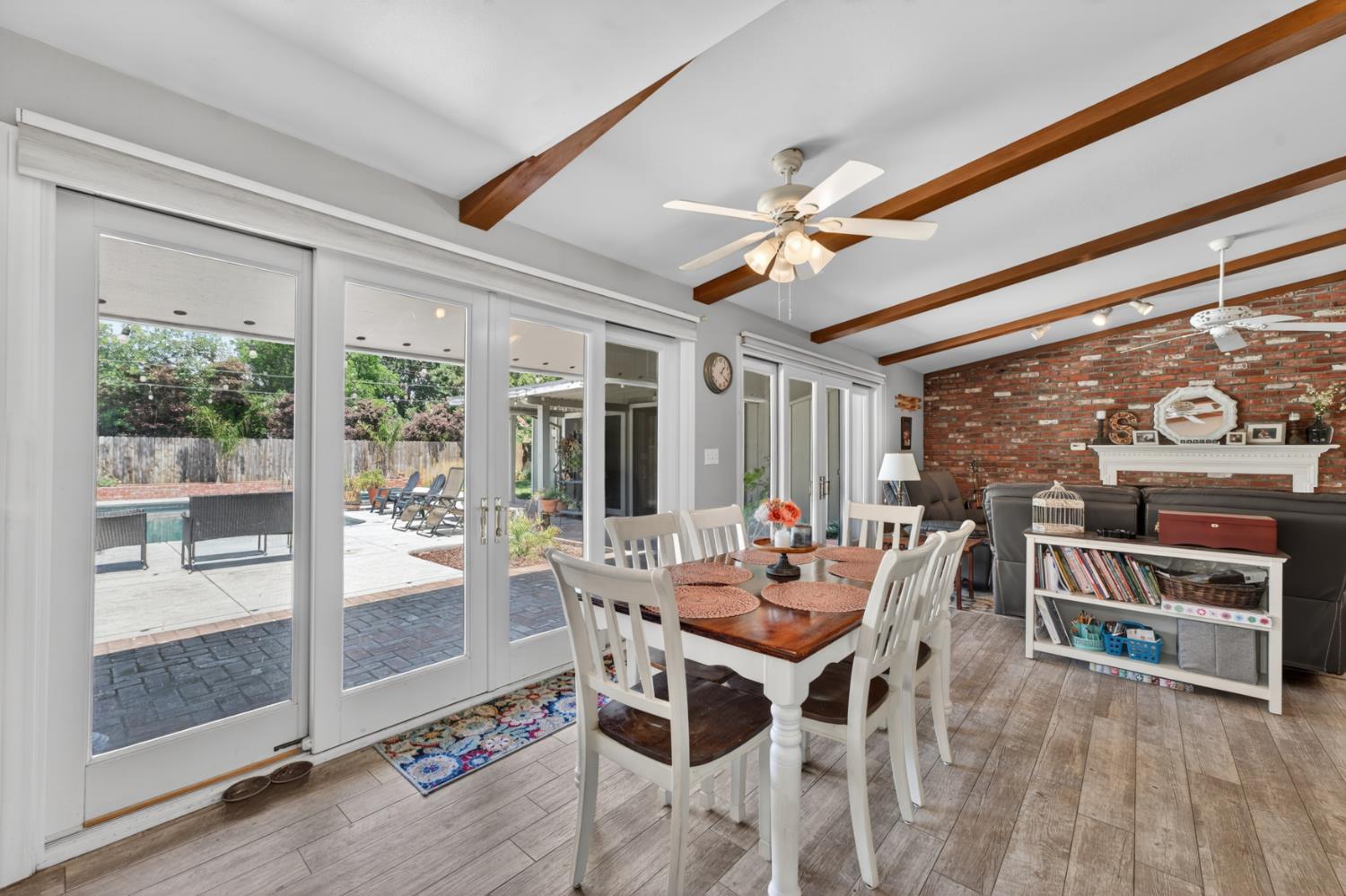 1880 Magnolia Street Gridley, CA 95948 - Photo 17 of 95 a dining room with furniture water view and a floor to ceiling window