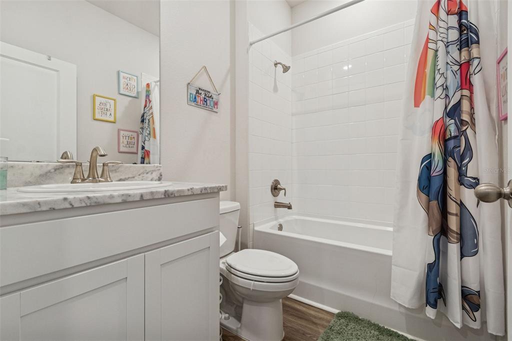 11965 Muskegon Court Parrish, FL 34219 - Photo 25 of 74 a bathroom with a sink a toilet and shower