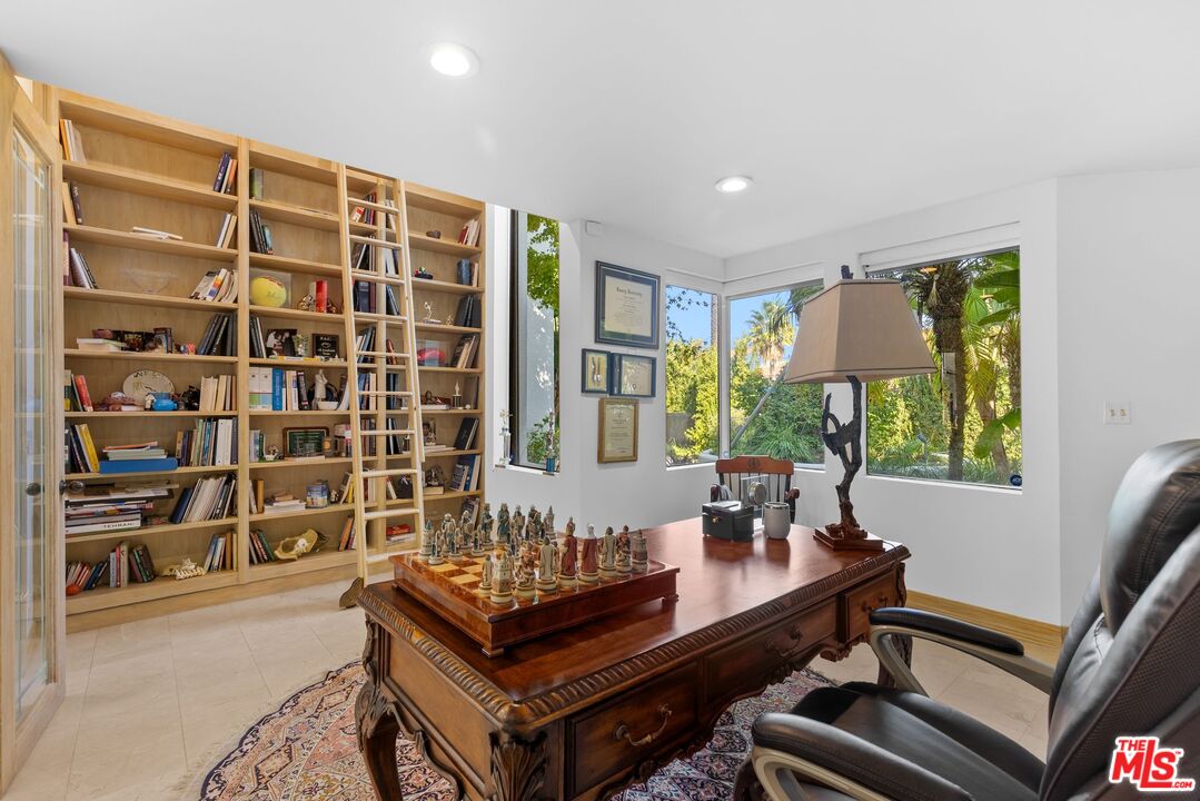 605 North Hillcrest Road Beverly Hills, CA 90210 - Photo 12 of 36 a view of a workspace with furniture and a window