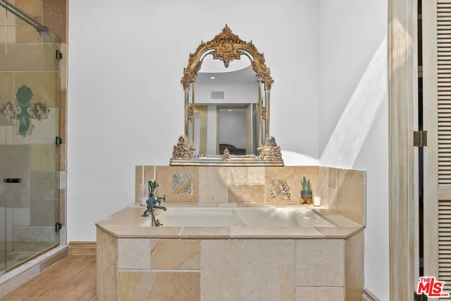 a bathroom with a sink and a mirror