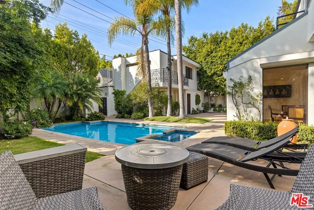 a view of a chairs and table in the patio
