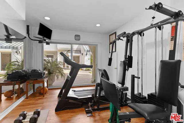 a view of a livingroom with furniture and a flat screen tv