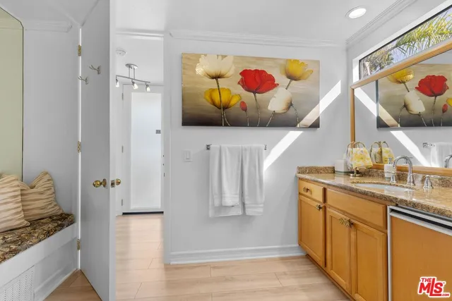 a kitchen with stainless steel appliances granite countertop a refrigerator and a stove