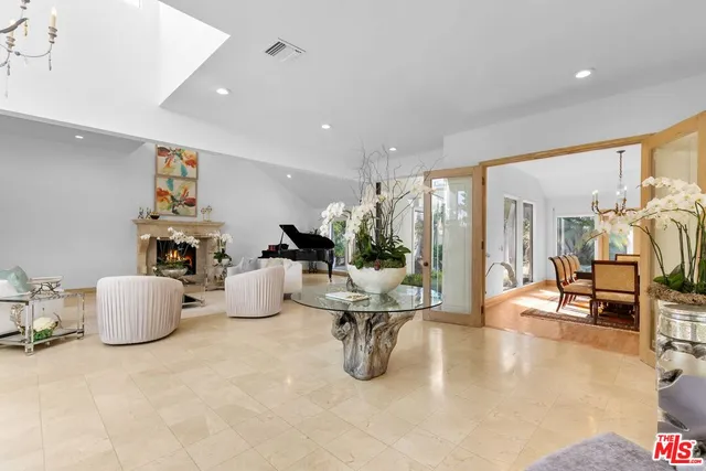 a room with table chairs and couches chair