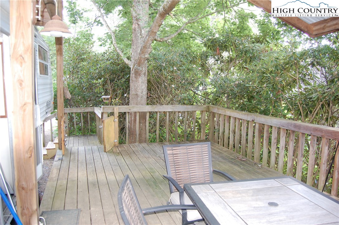 158 Trillium Road Newland, NC 28657 - Photo 3 of 12 a balcony with wooden floor and outdoor space
