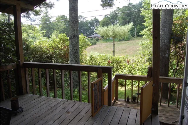 a view of balcony with wooden floor