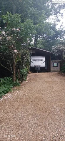a view of a car in front of a house