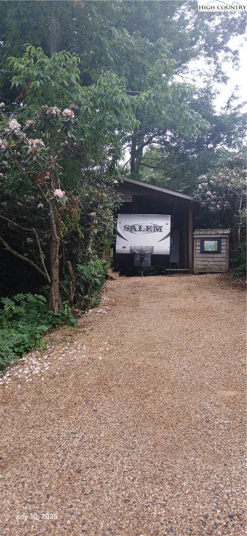 158 Trillium Road Newland, NC 28657 - Photo 10 of 12 a view of a car in front of a house