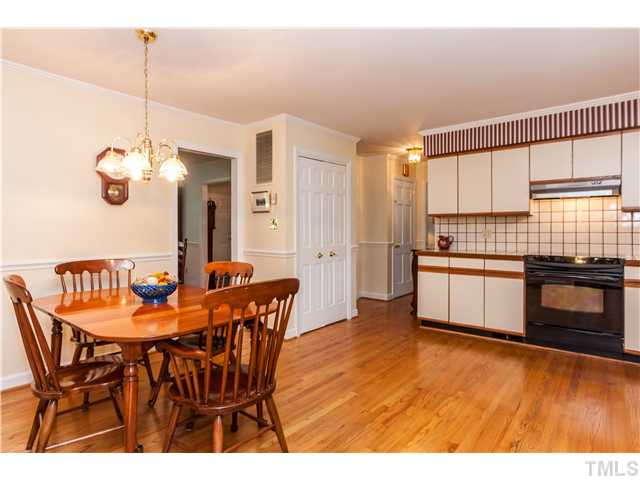 400 Foxhall Street Raleigh, NC 27609 - Photo 8 of 25 a dining room with a sink and kitchen view