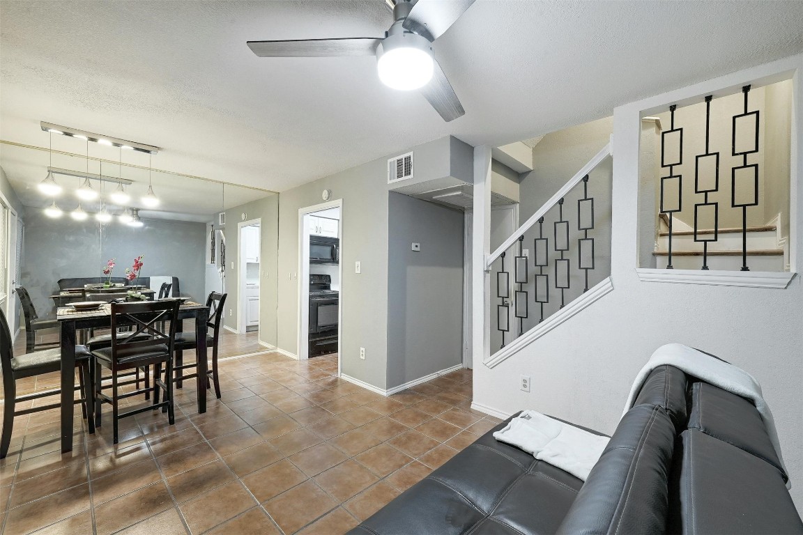 a view of a livingroom with furniture and a chandelier