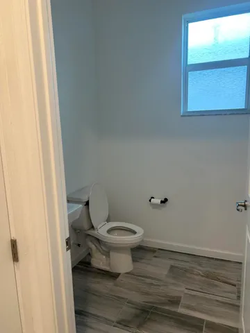 a kitchen with kitchen island a sink stainless steel appliances and cabinets